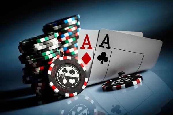 Teen Patti card hand showing three cards and betting chips